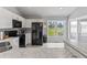 Spacious kitchen featuring white cabinets, marble countertops, and stainless steel appliances at 10753 Seaview Ln, Indianapolis, IN 46236