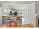 A view of the kitchen from dining, showcasing its open design and backyard view at 10753 Seaview Ln, Indianapolis, IN 46236