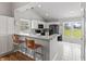 Open kitchen featuring white cabinets, marble countertops, and stainless steel appliances at 10753 Seaview Ln, Indianapolis, IN 46236
