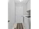 Bright laundry room features a modern washer and dryer, tile floor, and convenient access to storage at 10753 Seaview Ln, Indianapolis, IN 46236