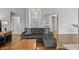 Spacious living room showcasing neutral tones and an inviting gray sofa at 10753 Seaview Ln, Indianapolis, IN 46236