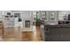 Spacious living room with open layout, fireplace, hardwood floors, and views of the backyard at 10753 Seaview Ln, Indianapolis, IN 46236