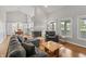 Bright living room with vaulted ceilings, fireplace, and hardwood floors at 10753 Seaview Ln, Indianapolis, IN 46236