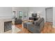 Cozy living room with fireplace, hardwood floors, and comfortable furniture at 10753 Seaview Ln, Indianapolis, IN 46236