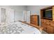 Main bedroom featuring wooden furniture, closet and a comfy bed at 10753 Seaview Ln, Indianapolis, IN 46236