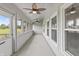 Inviting screened porch with ceiling fans and scenic views offers a tranquil retreat at 10753 Seaview Ln, Indianapolis, IN 46236