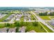 Wide aerial perspective of a well-planned community with lush greenery and manicured lawns at 10811 Wild Orchard Ln, Indianapolis, IN 46239