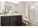 Bathroom featuring vanity with large mirror and walk-in shower at 10811 Wild Orchard Ln, Indianapolis, IN 46239