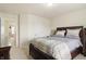 Comfortable bedroom with carpet, neutral colors, and soft natural light at 10811 Wild Orchard Ln, Indianapolis, IN 46239