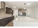 Bright kitchen featuring a large island, stainless steel appliances, and modern fixtures at 10811 Wild Orchard Ln, Indianapolis, IN 46239