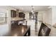 Open-concept kitchen with stainless appliances and a view into the dining area at 10811 Wild Orchard Ln, Indianapolis, IN 46239