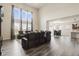Spacious living room with high ceilings, large windows, and comfortable seating area at 10811 Wild Orchard Ln, Indianapolis, IN 46239