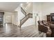 Spacious living room with staircase, contemporary decor, and an open floor plan at 10811 Wild Orchard Ln, Indianapolis, IN 46239