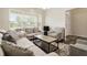 Comfortable living room with a window view and contemporary furnishings at 10811 Wild Orchard Ln, Indianapolis, IN 46239