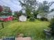 Spacious backyard with lush lawn, shed, and privacy fence offers plenty of outdoor space at 111 S Jefferson St, Brownsburg, IN 46112