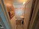 Compact bathroom with wainscoting and pedestal sink at 111 S Jefferson St, Brownsburg, IN 46112