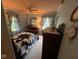 Cozy bedroom with a patterned quilt and matching curtains at 111 S Jefferson St, Brownsburg, IN 46112