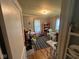 Cozy bedroom with hardwood floors and a blue and white striped rug at 111 S Jefferson St, Brownsburg, IN 46112