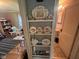 Hallway showcasing unique shelving and a peak into the bathroom at 111 S Jefferson St, Brownsburg, IN 46112