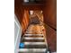 Basement stairway showcases the access point to additional living space with storage potential at 111 S Jefferson St, Brownsburg, IN 46112