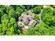 Aerial view of a secluded estate with large patio and well-maintained landscaping at 11557 Willow Springs Dr, Zionsville, IN 46077