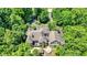 Aerial view of grand luxury house showcasing its architecture, landscape, outdoor patio with trees at 11557 Willow Springs Dr, Zionsville, IN 46077