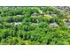 Beautiful homes nestled among trees in a charming neighborhood with lush green yards at 11557 Willow Springs Dr, Zionsville, IN 46077