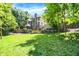 Expansive lawn with mature trees in the backyard offering a blend of open space and natural beauty at 11557 Willow Springs Dr, Zionsville, IN 46077
