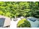 Aerial view of backyard featuring patio, lounge furniture, and lush landscaping at 11557 Willow Springs Dr, Zionsville, IN 46077
