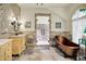 Luxurious bathroom with marble tile, dual sinks, soaking tub and glass shower at 11557 Willow Springs Dr, Zionsville, IN 46077