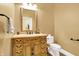 Classic bathroom features an ornate vanity, mirror, and fixtures at 11557 Willow Springs Dr, Zionsville, IN 46077