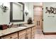 Bathroom with a spacious granite countertop vanity and a tiled walk-in shower at 11557 Willow Springs Dr, Zionsville, IN 46077