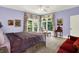 Well-lit bedroom featuring a carpeted floor, a double bed, and bright, natural light at 11557 Willow Springs Dr, Zionsville, IN 46077