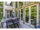 Outdoor deck featuring metal table and chairs with doors leading inside at 11557 Willow Springs Dr, Zionsville, IN 46077