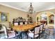 Formal dining room features wood floors, seating for eight, and adjacent butler's pantry at 11557 Willow Springs Dr, Zionsville, IN 46077
