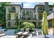 Exterior of home with stone facade, balconies and manicured yard at 11557 Willow Springs Dr, Zionsville, IN 46077