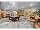 Finished basement game room complete with pool table, ornate paintings and decorative animal mounts at 11557 Willow Springs Dr, Zionsville, IN 46077