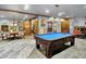 Inviting game room with a pool table, adjacent to dining area, perfect for social gatherings at 11557 Willow Springs Dr, Zionsville, IN 46077