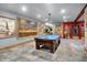 Spacious game room with a pool table and unique decor; great for entertaining guests at 11557 Willow Springs Dr, Zionsville, IN 46077