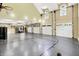 Multi-use garage featuring a half basketball court and tall windows at 11557 Willow Springs Dr, Zionsville, IN 46077