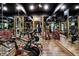 Well-equipped gym with mirrors, fitness machines, and wooden floors for a complete workout space at 11557 Willow Springs Dr, Zionsville, IN 46077