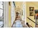 Grand hallway featuring tile floors, chandelier lighting, and wall art at 11557 Willow Springs Dr, Zionsville, IN 46077