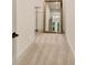 Hallway with recessed lighting and carpet, door, mirror and open closet at 11557 Willow Springs Dr, Zionsville, IN 46077