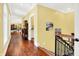Elegant hallway features hardwood floors, crown molding, and access to various rooms at 11557 Willow Springs Dr, Zionsville, IN 46077