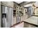 Granite counters, stainless appliances, and tile backsplash accent the kitchen, with plenty of storage and natural light at 11557 Willow Springs Dr, Zionsville, IN 46077