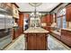 Beautiful kitchen featuring a large island, custom cabinets, stainless steel appliances, and luxurious finishes at 11557 Willow Springs Dr, Zionsville, IN 46077