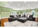 Spacious living room with vaulted ceilings, a large sectional, and hardwood floors at 11557 Willow Springs Dr, Zionsville, IN 46077