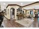 Open-concept living space with bar seating and an adjacent dining area is ideal for entertaining at 11557 Willow Springs Dr, Zionsville, IN 46077