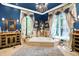 Luxurious bathroom featuring a jacuzzi tub, chandelier lighting, and dual vanities at 11557 Willow Springs Dr, Zionsville, IN 46077