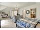 Spacious main bedroom boasts a sitting area, chandelier, and ensuite bathroom for ultimate relaxation at 11557 Willow Springs Dr, Zionsville, IN 46077